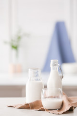 Glassware of fresh milk on table