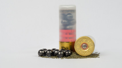12 gauge shotgun ammunition on a white background