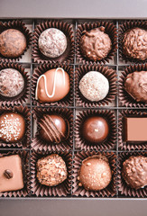 Box with delicious candies, closeup