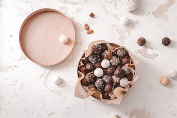 Box with delicious candies on white background