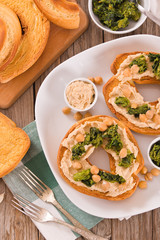 Friselle with turnip tops and hummus.