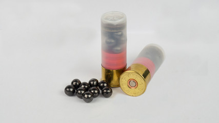 12 gauge shotgun ammunition on a white background