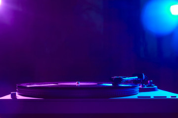 Retro wave, 80s. Record player with neon light. Vinyl analog turntable. Synthwave and vaporwave concept.