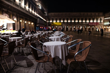 Cozy street cafe on St Mark's Square in evening Venice, Italy. Architecture and landmark of Venice