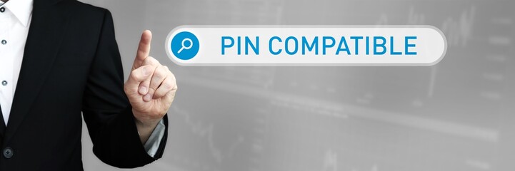 Pin Compatible. Man in a suit points a finger at a search box. The word Pin Compatible is in the search. Symbol for business, finance, statistics, analysis, economy