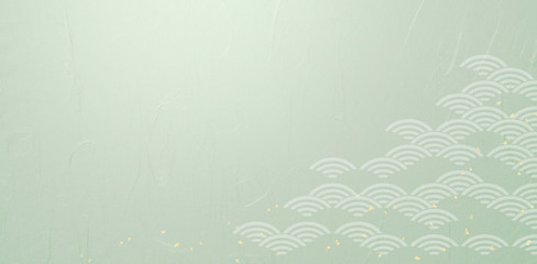 Fototapeta na wymiar 波紋のパーターンとグリーンの和紙の背景素材