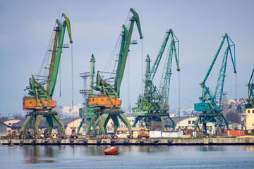 Fototapeta premium Cranes in a shipyard used for wheat and coal shipping