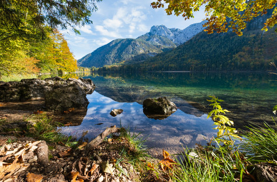 Peaceful autumn Alps mountain lake with clear transparent water and reflections. Langbathseen lake, Upper Austria.