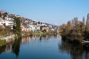 Fototapeta na wymiar ZURICH, SWITZERLAND - MARCH 19, 2020: Area of Zurich along the bank of the river Limmat