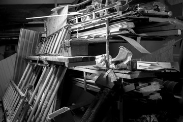 Big mess in an over stuffed suburban garage.