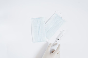 Single blue mask for protection against viruses, on white background, covid-19, crown virus, hands protection 