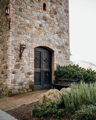 Castle tower door and a bench