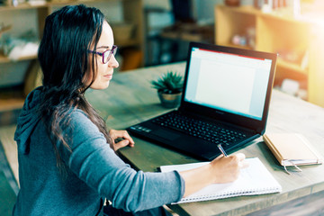 Modern business successful busy woman at the table with laptop write planning. Modern technology...