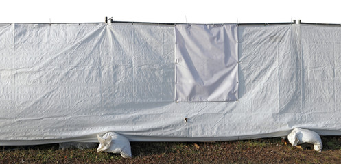Temporary white plastic fence protects the quarantine zone during a pandemic isolated