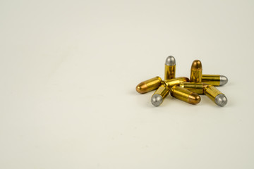 .45 acp bullet on white background.