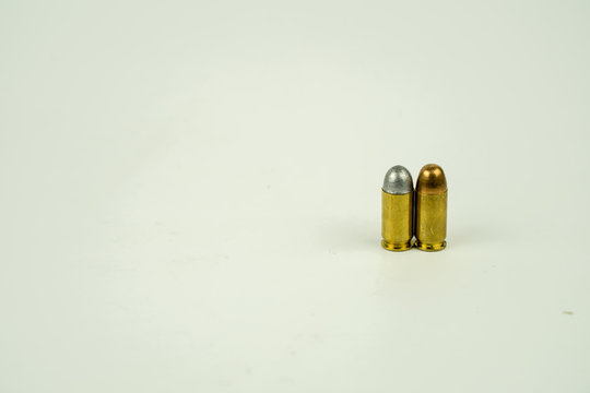 .45 acp bullet on white background.