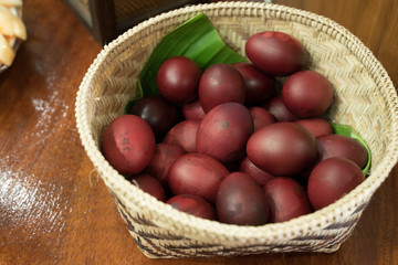 Red eggs dyed in bamboo baskets to give as a New Year's gift.