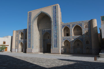 Fototapeta na wymiar Ulugbek Madrasah on the background of blue sky. Bukhara, Uzbekistan, Central Asia.