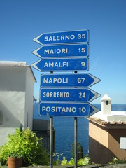 Traffic signs with different places in Amalfi Coast (Salerno, Maiori, Amalfi, Napoli and Positano)