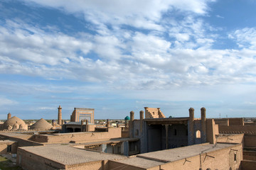 View at Itchan Kala (old or inner city) and Tash Khauli palace (or Tosh Hovli, 19th century). Khiva, Uzbekistan, Central Asia.