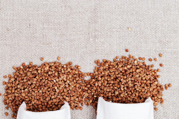 Sack bags of buckwheat. Concept of healthy food, rich harvest. Copy space for your text.