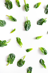 Spinach pattern background on white. Top view