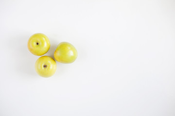 Top view of fresh yellow apple isolated on white background.