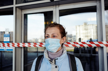Woman wearing hygienic mask to prevent the Coronavirus.People in masks The outbreak of Novel Corona...