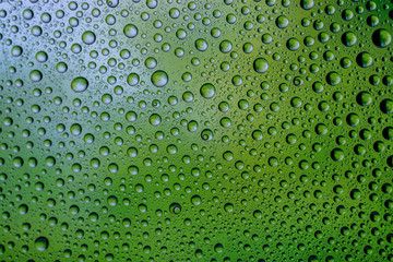 Water drops on window glass. Rain texture or wet pattern background.