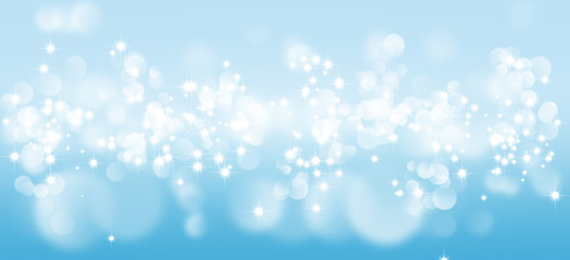 Abstract blurry image of light and blue bokeh background.