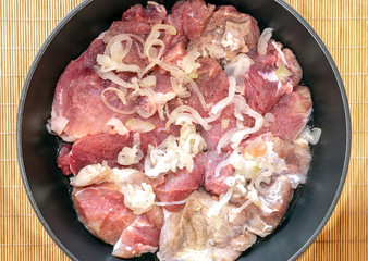 Raw beef in marinade prepared for roasting