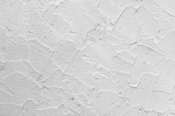 White grey concrete wall texture plastering wave seamless patterns on light bright modern interior...