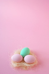 Eggs pink and mint color, several pink background. Easter concept