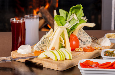 cheese plate next to it raki or wine