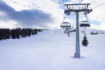 Ski slope with ski lifts on the ski resort