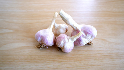 Garlics on the wooden table