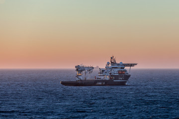Fototapeta na wymiar MONTROSE, SCOTLAND - 2015 NOVEMBER 01. Offshore Subsea Construction vessel Olympic Ares at sunrise.