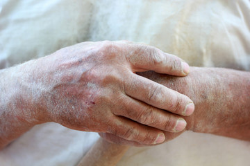 Fototapeta premium wooden cane in adult male hands