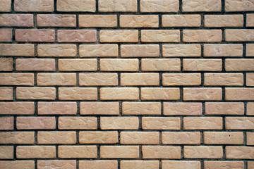 Background of light decorative brick wall texture.