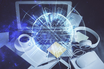 Double exposure of business theme icons and work space with computer background. Concept of success.