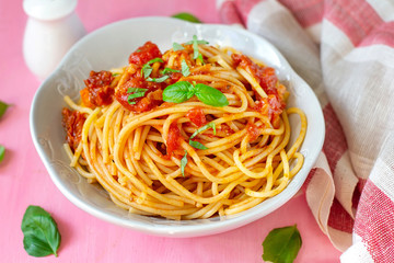 Italian pasta spaghetti with tomatoes and basil
