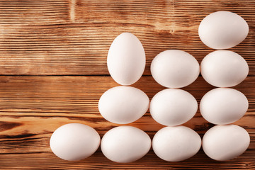 The egg goes up a ladder of other eggs. The concept of dishonest career growth.