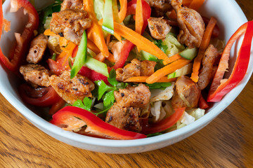 Caesar salad - vegetable salad with roast chicken meat