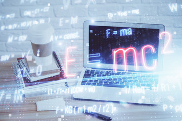 Desktop computer background and formula hologram writing. Double exposure. Education concept.