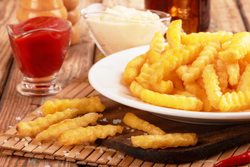 french fries on wooden table