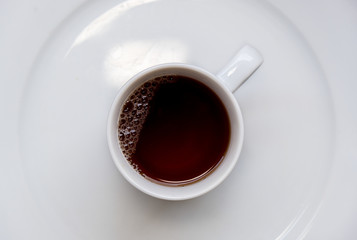 Healthy black tea on a cup