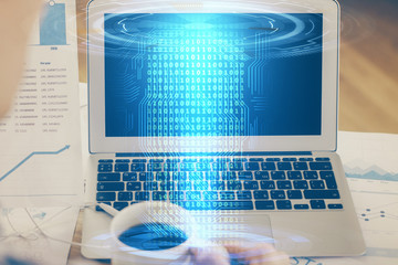 Double exposure of laptop computer and technology theme hologram. Concept of freelance work.