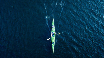 athlete kayaks on the river . Travel or kayaking concept. Drone shot, aerial view, picture with place for your text
