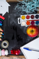 blackboard and school supplies, apple