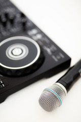 Fototapeta na wymiar microphone and dj controller on a white background